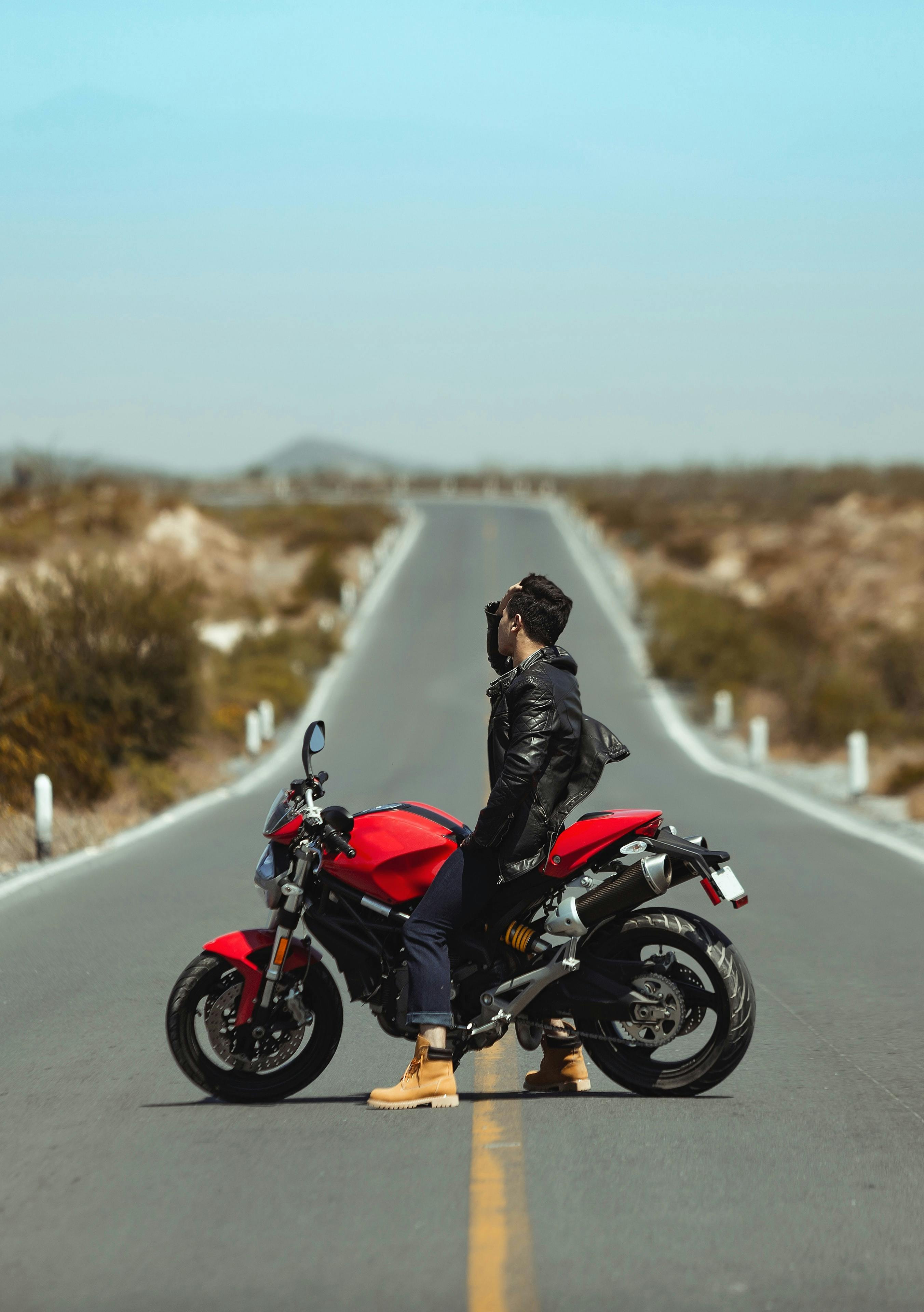 biker on motorcycle on empty road