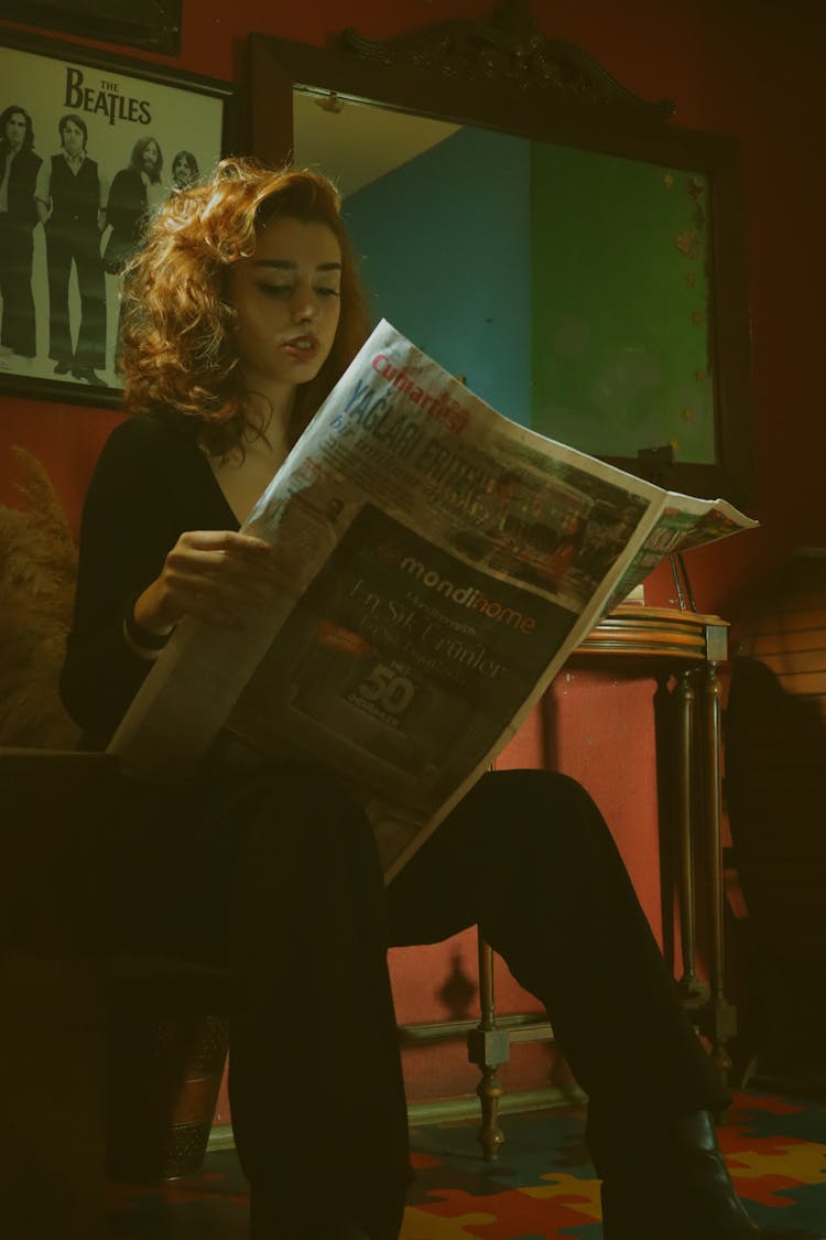 A Woman Reading Newspaper