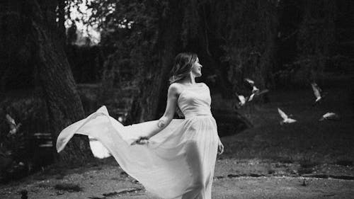 Black and White Photo of a Woman in a Dress