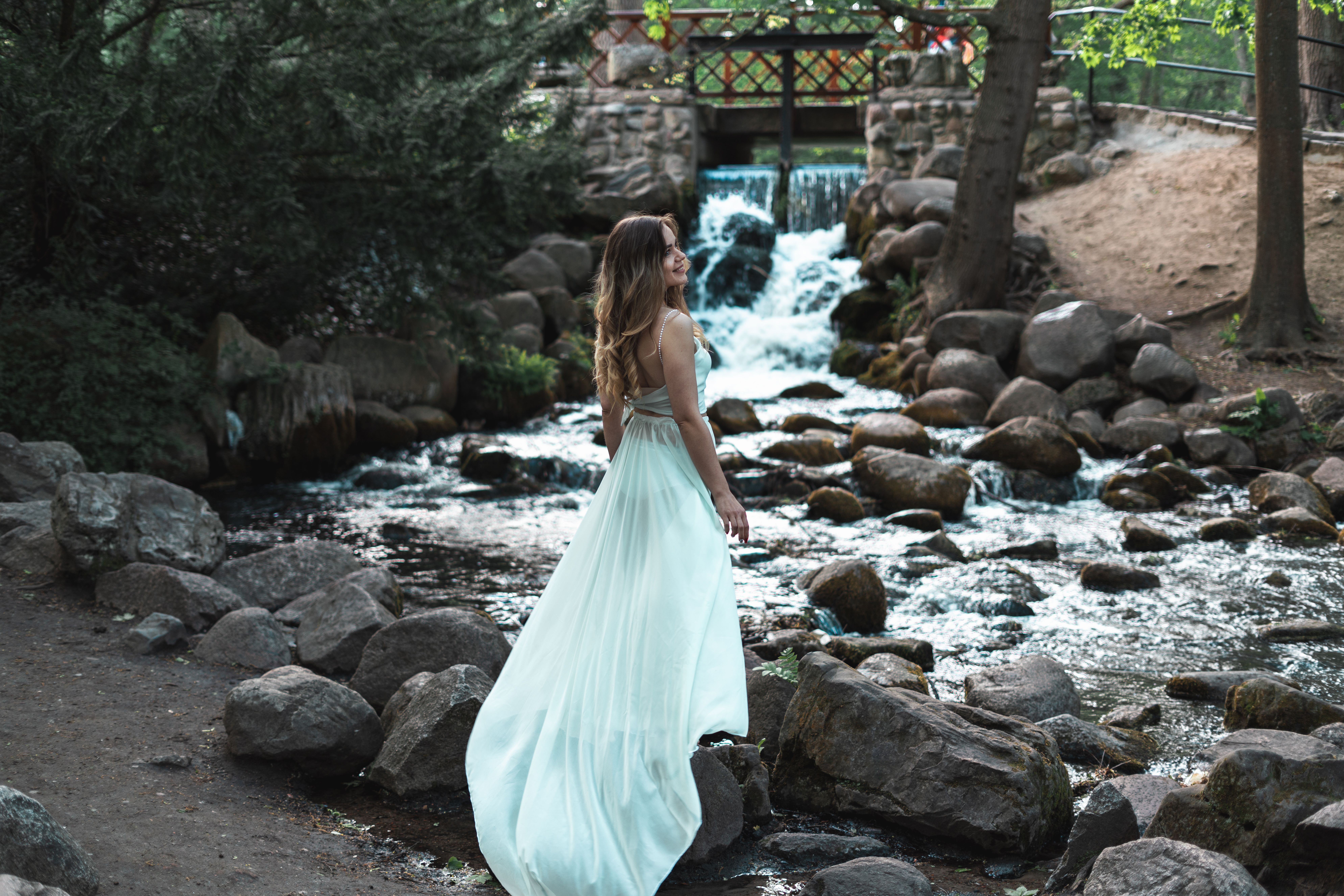 Woman in White Dress Standing on Rock near a River · Free Stock Photo