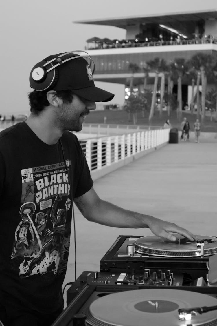 Black And White Photo Of Dj Using An Audio Mixer