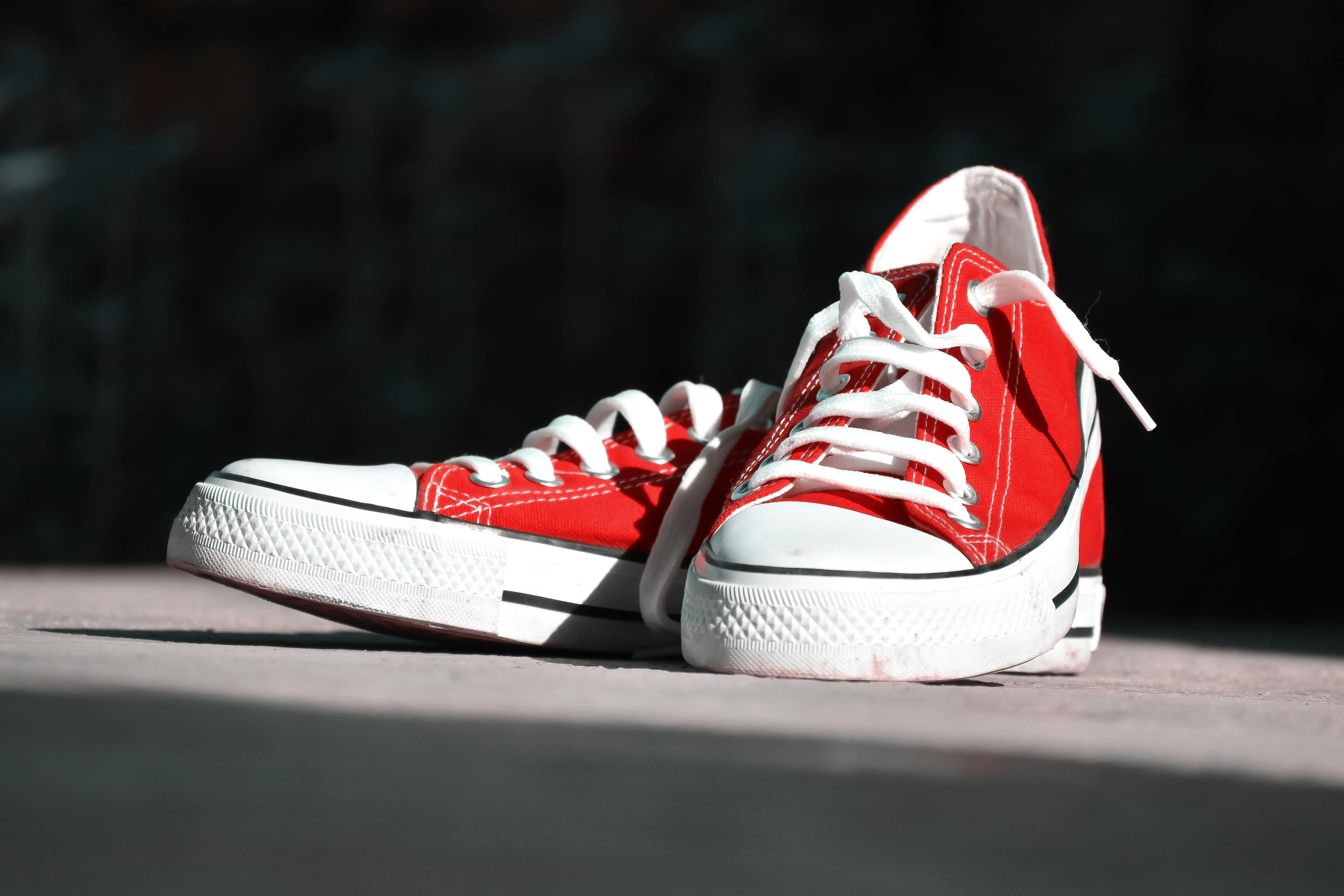 Shallow Focus Photography of Pair of Red Low-top Sneakers