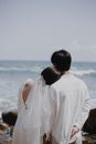 Woman in White Shirt Standing Near Body of Water