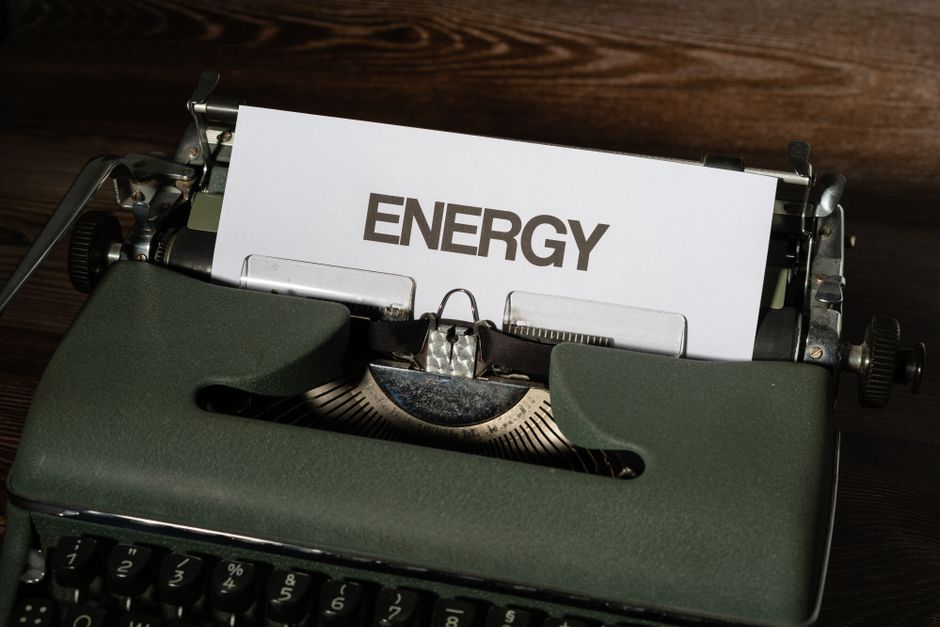 Close-up of a vintage typewriter with the word 'ENERGY' on paper, evoking nostalgia.