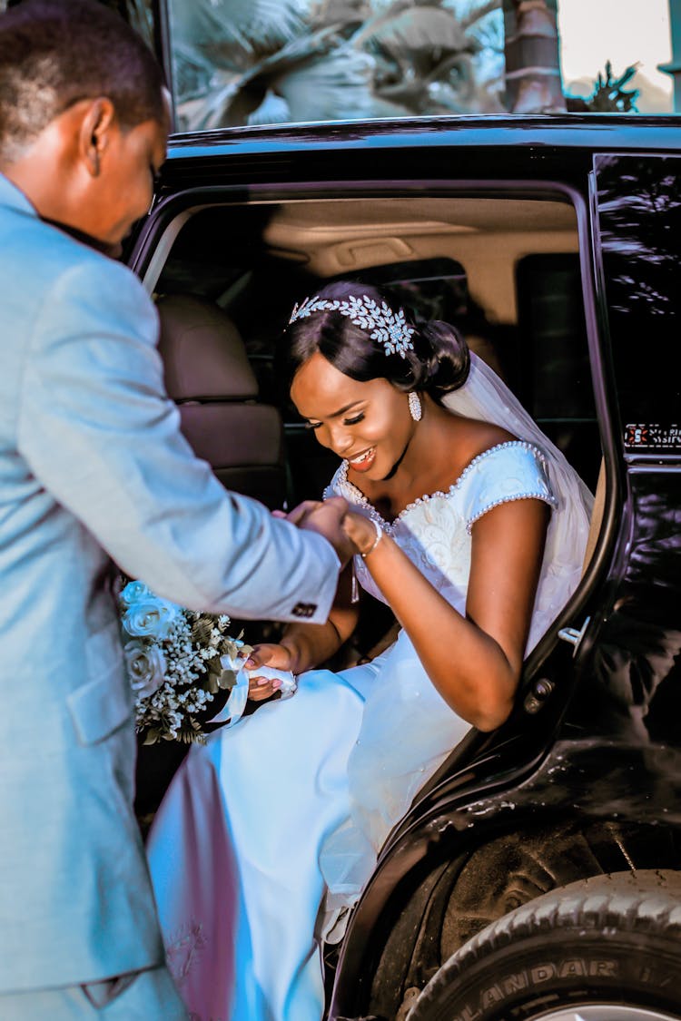 A Bride Getting Down From The Bridal Car