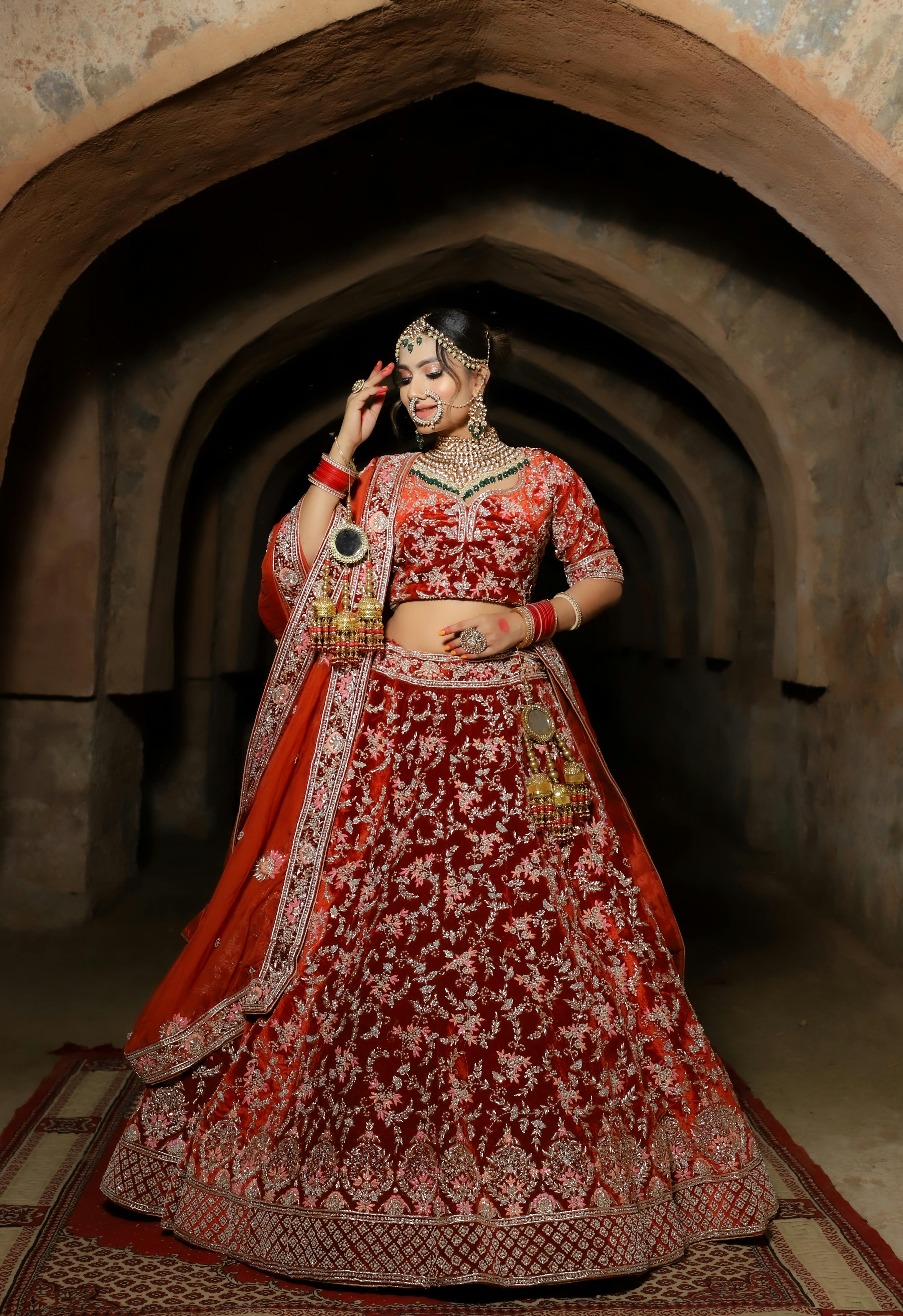 Which color of lehenga looks good for a wedding, red or maroon? - Quora