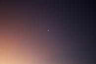 Tiny Moon Against the Gradient in the Sky