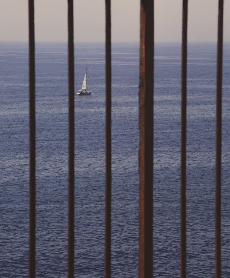 Ship Sailing In Sea View Through Gates