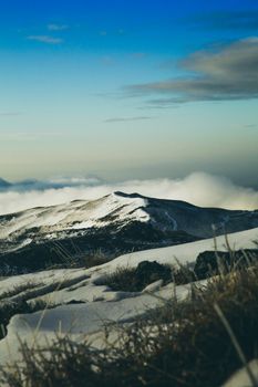 A breathtaking snow-covered mountain landscape under a clear blue sky, perfect for nature enthusiasts.
