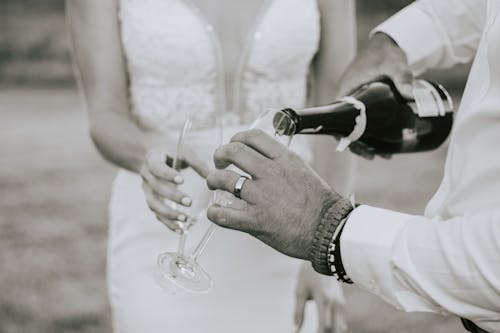 Close-up of Bride and Groom Drinking Champagne 
