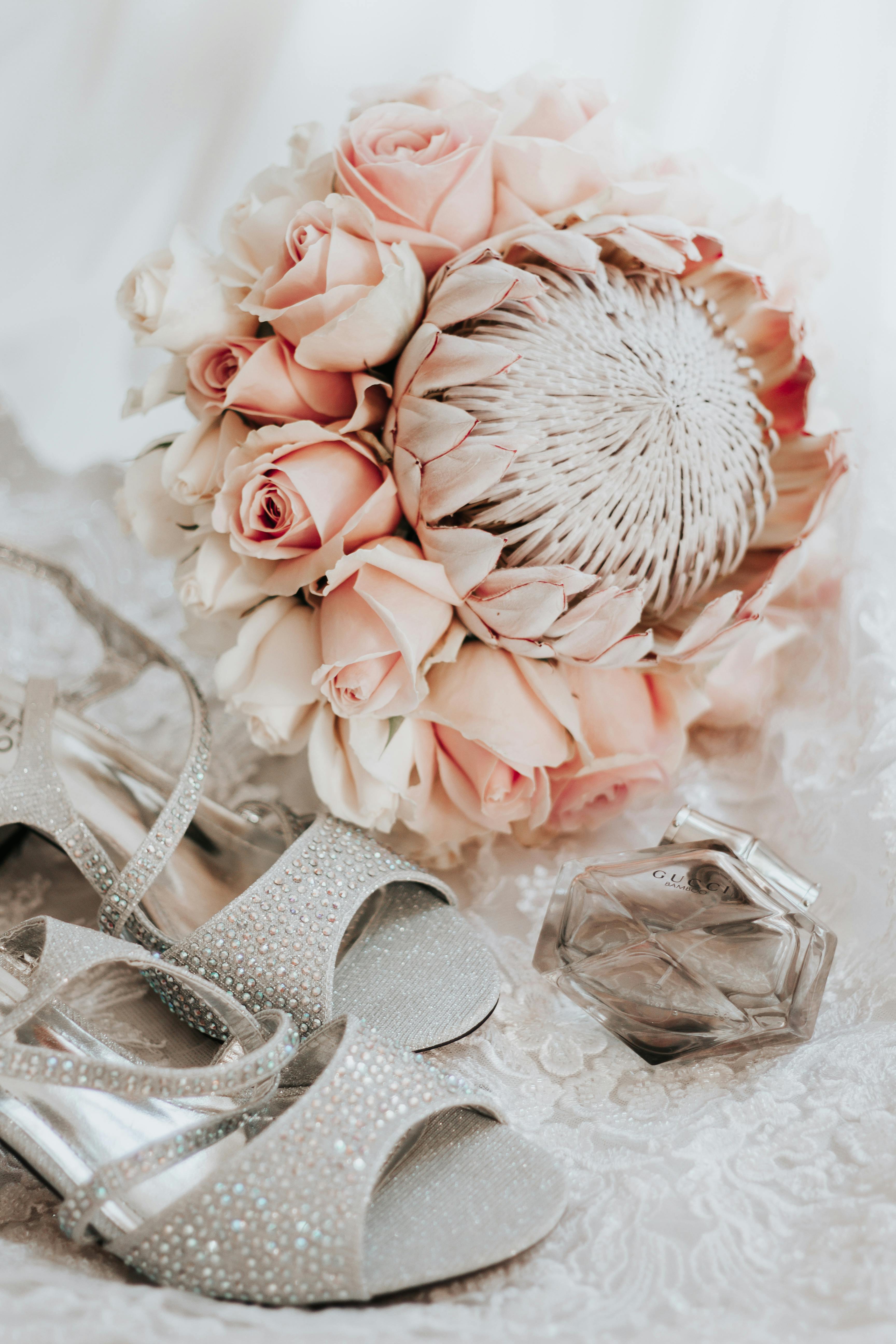 close up of bride shoes and flowers bouquet