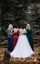 Woman in Red Dress Standing Beside Woman in White Dress