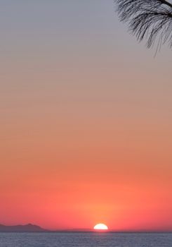 Captivating sunset with vibrant hues over Bodrum, Turkey's serene Aegean coast.