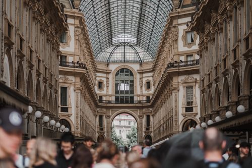 Free A bustling crowd inside Galleria Vittorio Emanuele II in Milan, Italy, showcasing its iconic architecture. Stock Photo