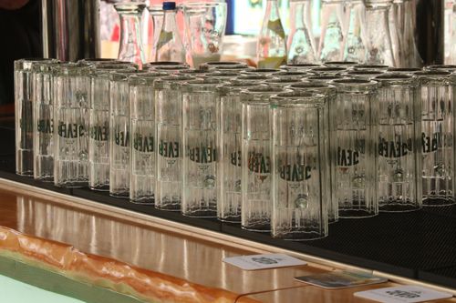 Free A neat arrangement of upside down beer glasses on a bar counter in Munich, Germany. Stock Photo