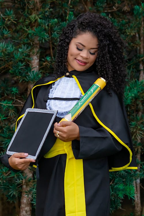 Free A Woman in Black Graduation Gown Stock Photo