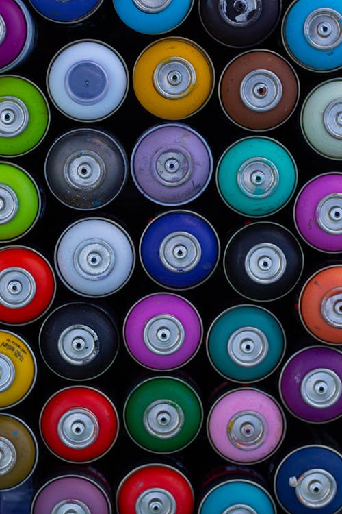 Free Multi Colored Spray Paint Canisters Stock Photo