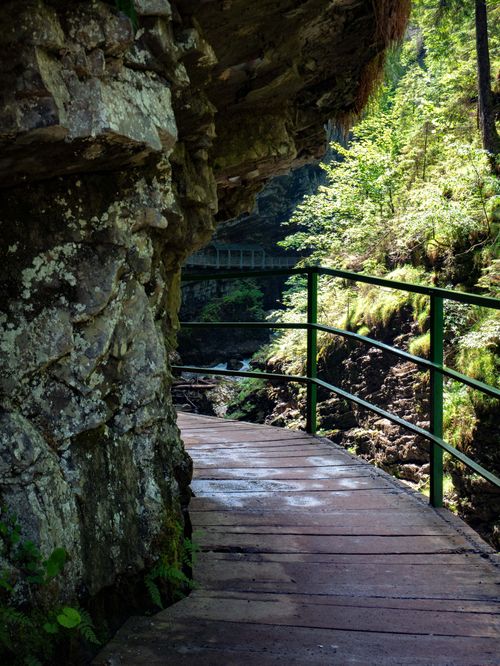 Free Tranquil boardwalk path with stunning rock formations in Oberstdorf, Germany. Stock Photo