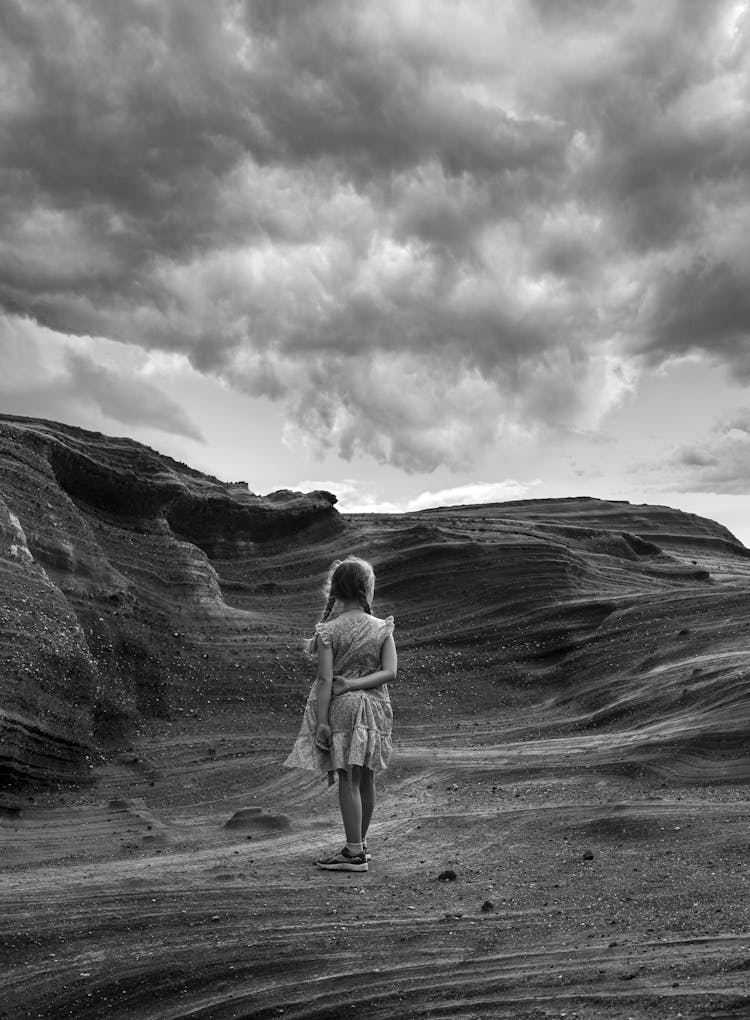 Back View Of Little Girl In Desert Mountains