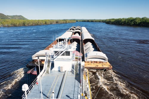 Barges Cascading a River