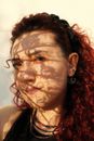 Woman With Red and White Face Paint