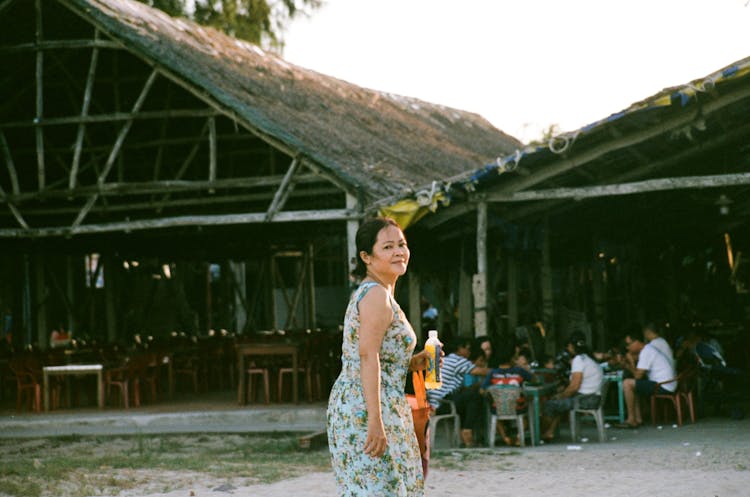 Smiling Woman In Front Of Restaurant