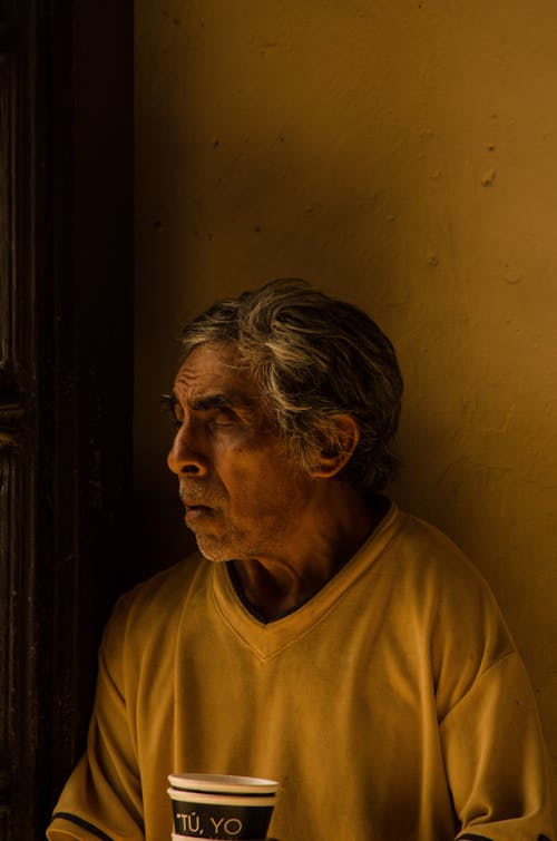 An Elderly Man Wearing a V-neck T-shirt