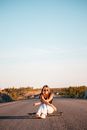 Woman in Pink Tank Top Standing on Road