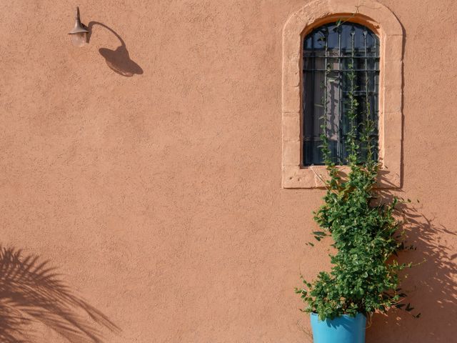 A rustic wall with an arched window — photo by Ann Perkas on Pexels