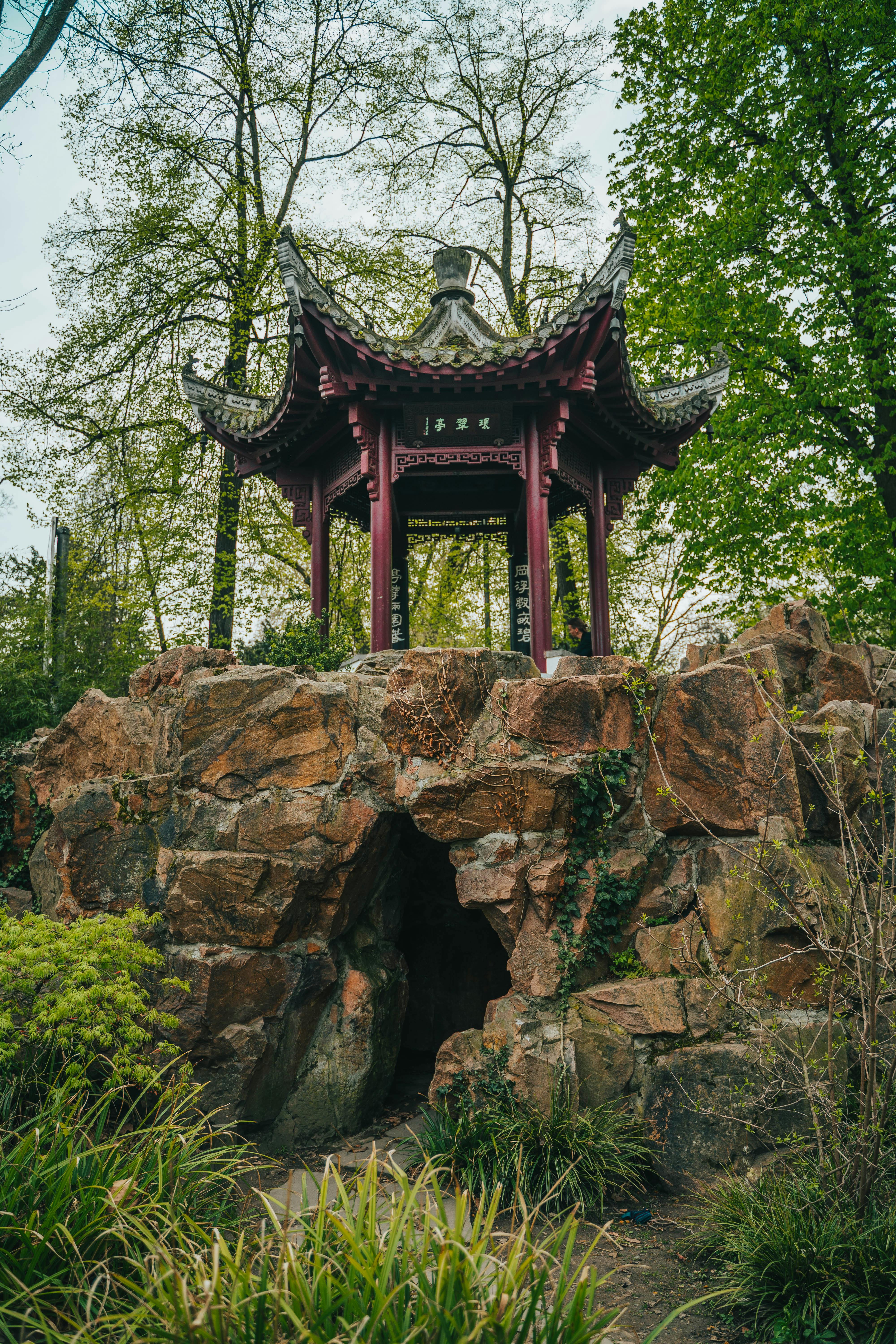 Red and Gray Wooden Pagoda on Brown Rock Formation · Free Stock Photo