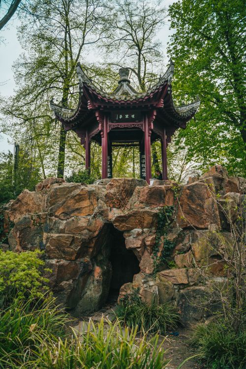 Red and Gray Wooden Pagoda on Brown Rock Formation · Free Stock Photo