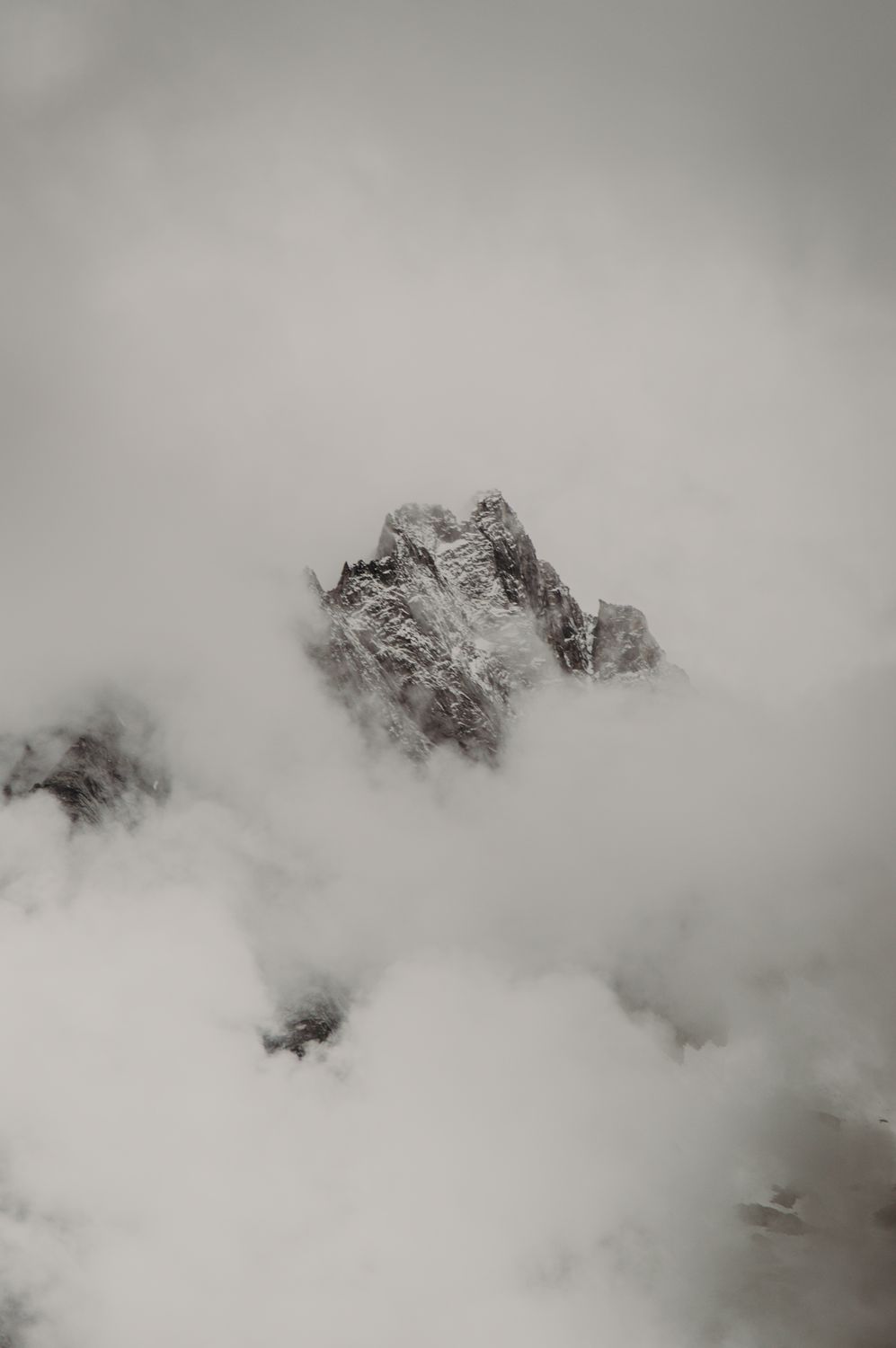 Gray and White Mountain Covered by White Clouds · Free Stock Photo
