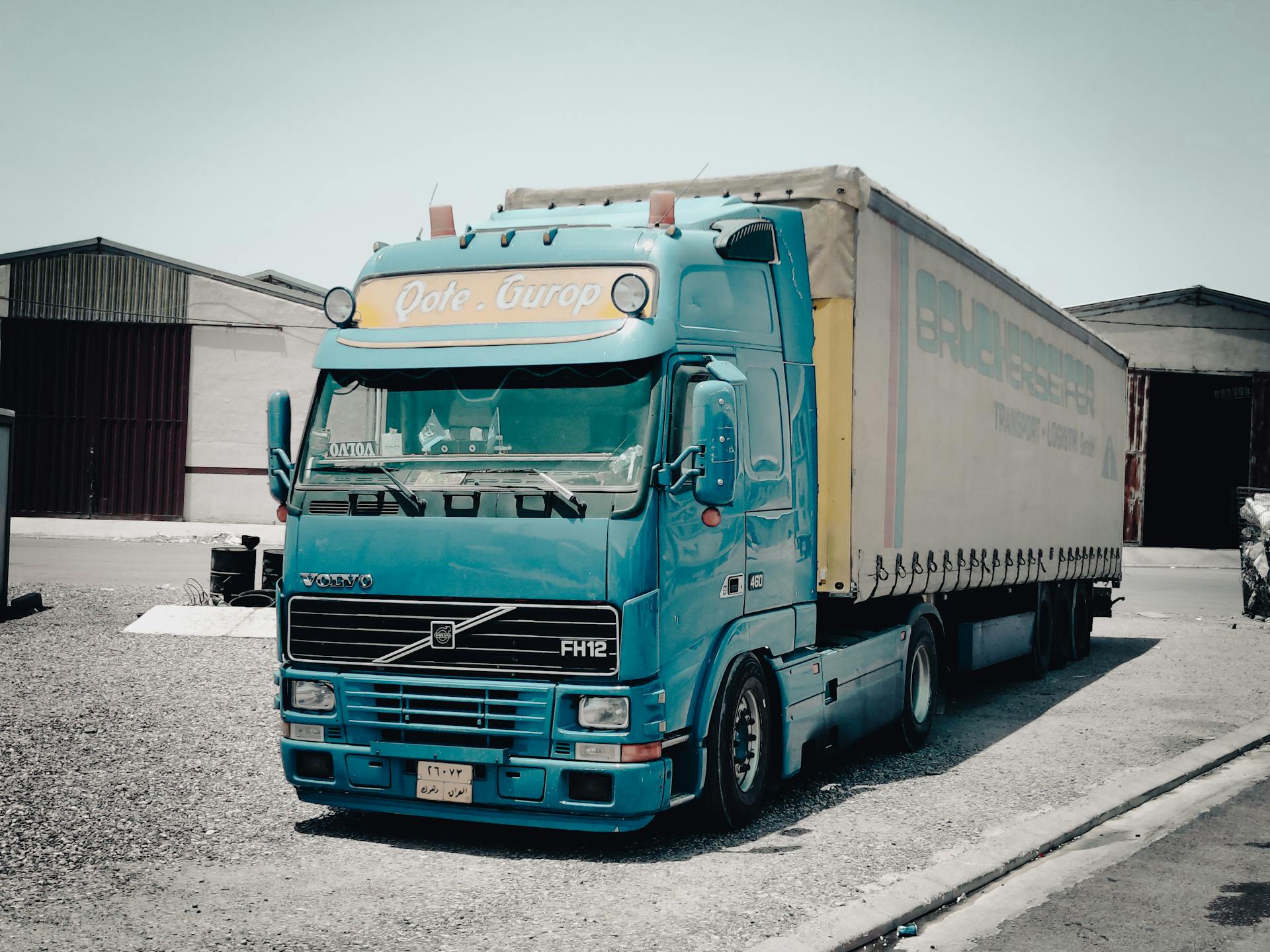 Blue and White Truck on Road