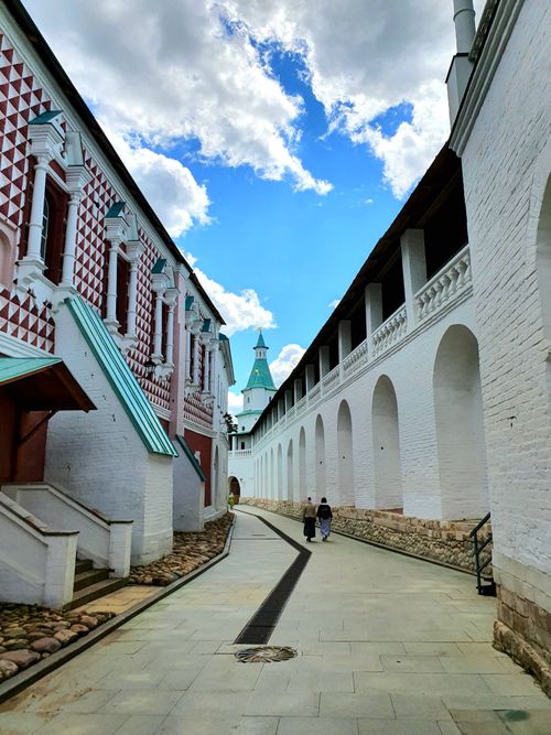 Free A captivating view of the New Jerusalem Monastery's alley under a vibrant sky in Istra, Russia. Stock Photo