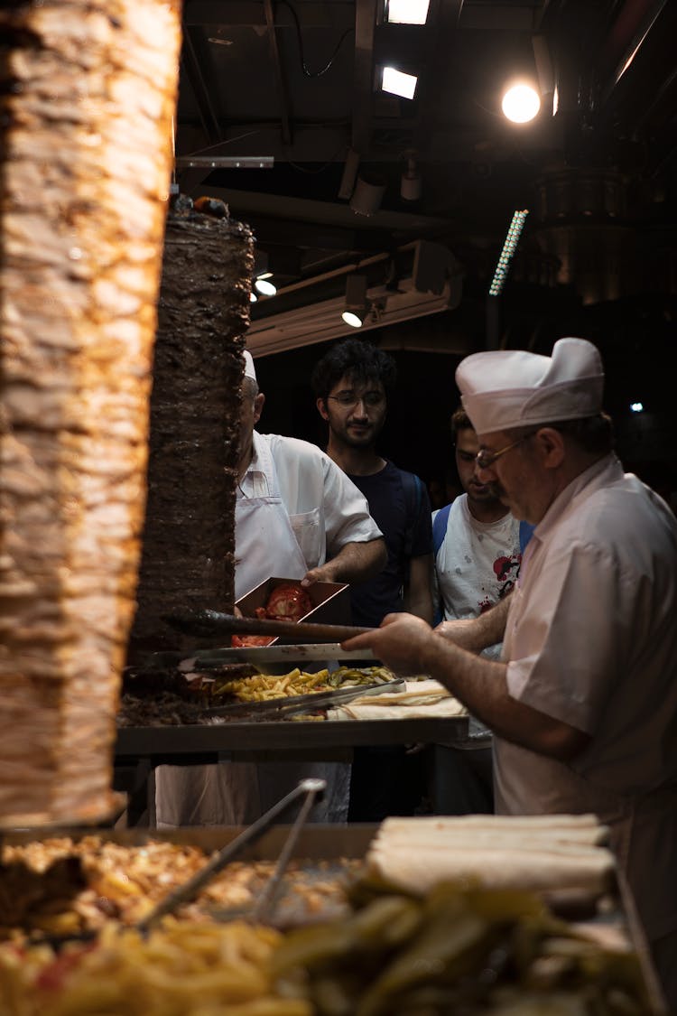 Man Slicing The Shawarma 