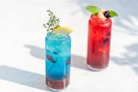 Colorful Cocktails on White Table Background