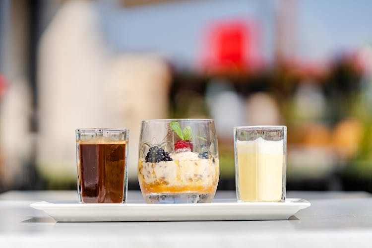 Summer Cocktails And Dessert On Tray In Cafe