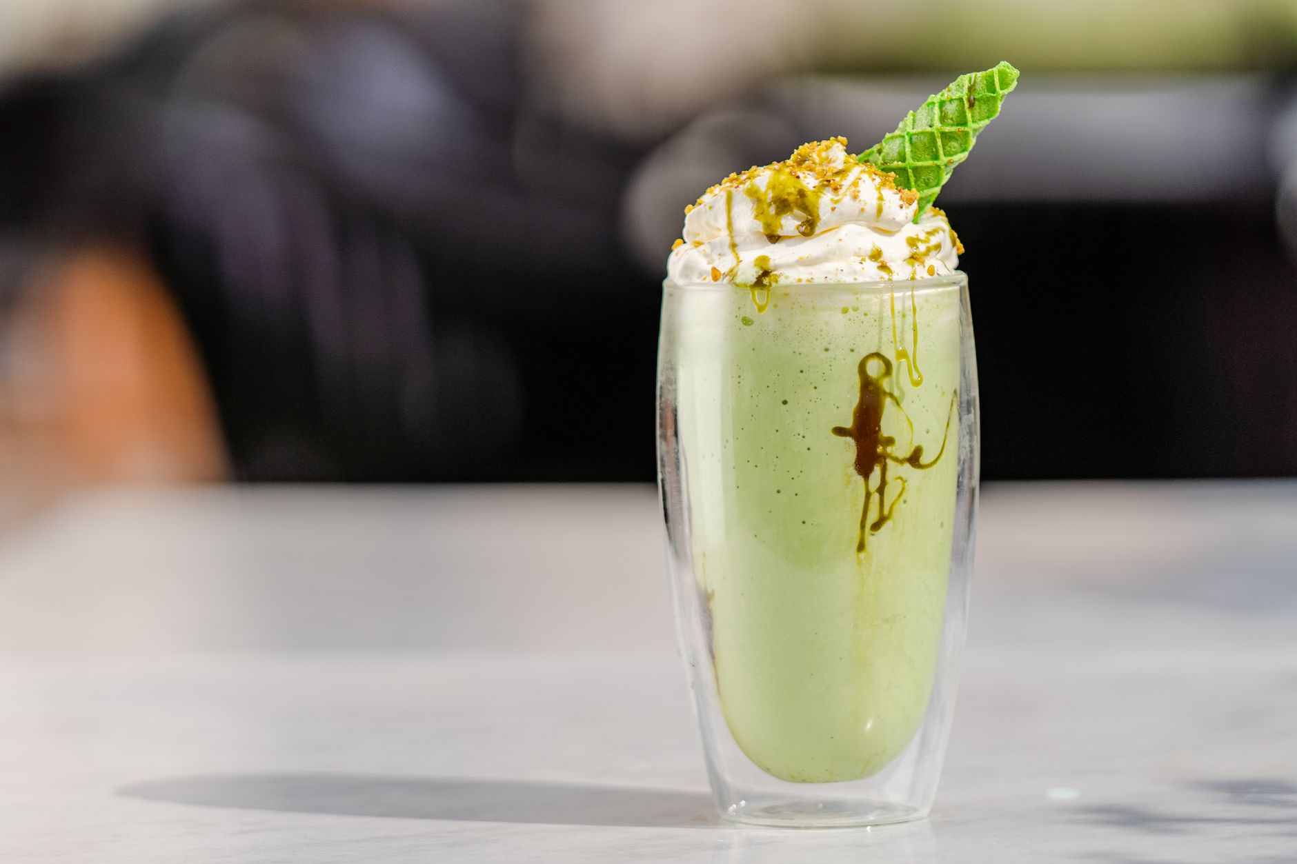 Creamy Shake Shack milkshake with whipped cream and cherry topping