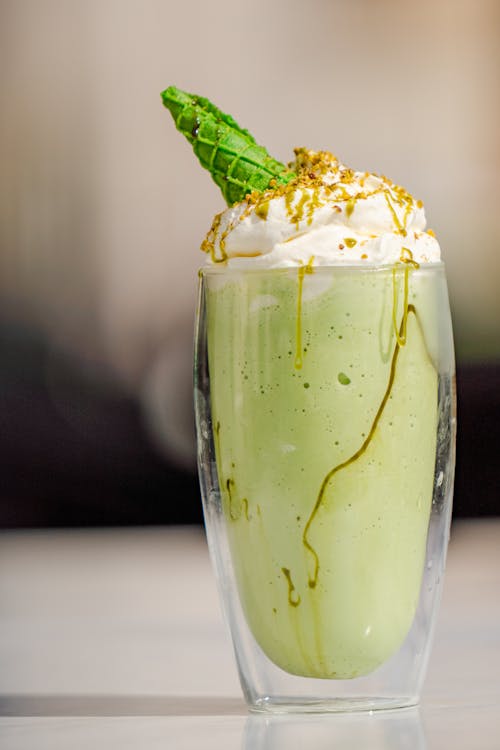 Pistachio Milkshake Served in a Restaurant 