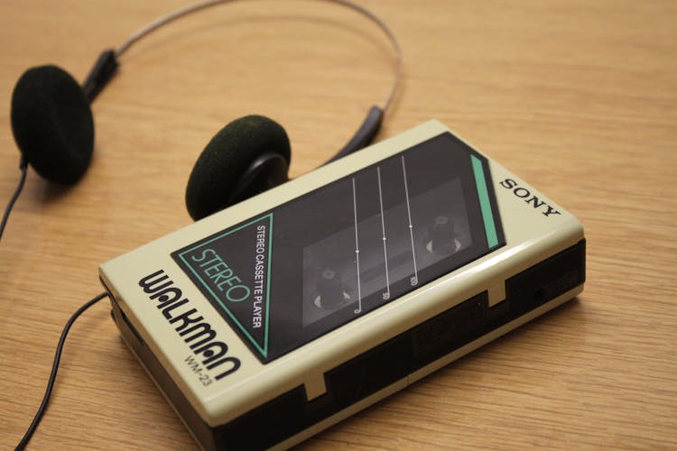 Close-Up Shot Of A Vintage Sony Walkman And Black Headphones