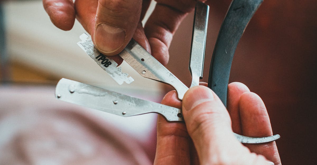 A Person Holding a Set of Razors · Free Stock Photo