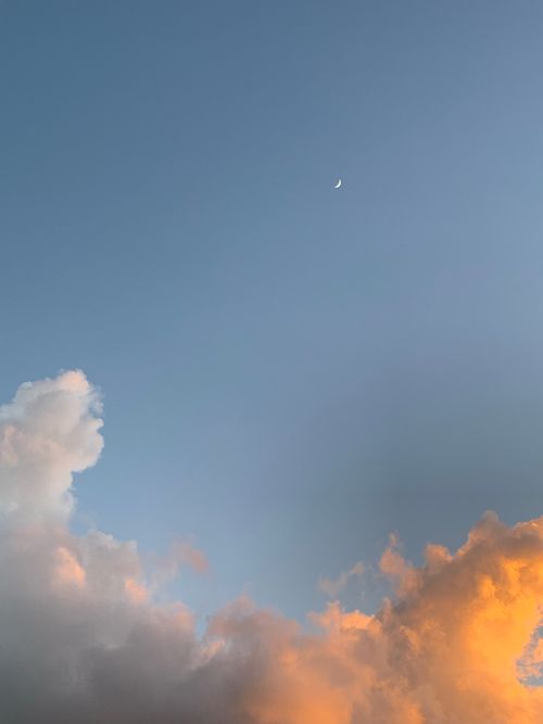 Free Beautiful evening sky with clouds and moon in Dominican Republic, showcasing a serene sunset ambiance. Stock Photo