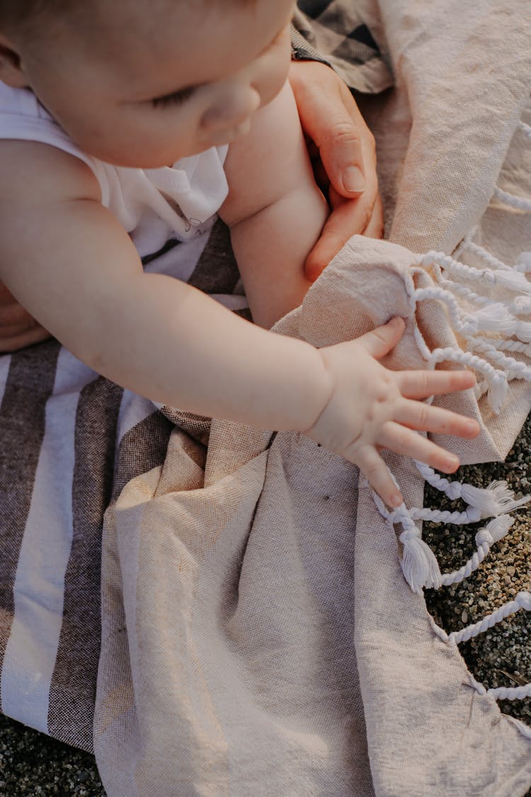 Close Up Of Baby And Mother Hands