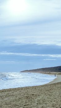 Quiet beach scene with ocean waves in Puerto Escondido, Mexico.
