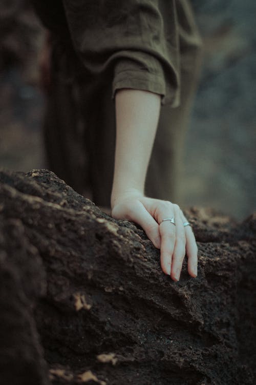 Woman Touching Rock