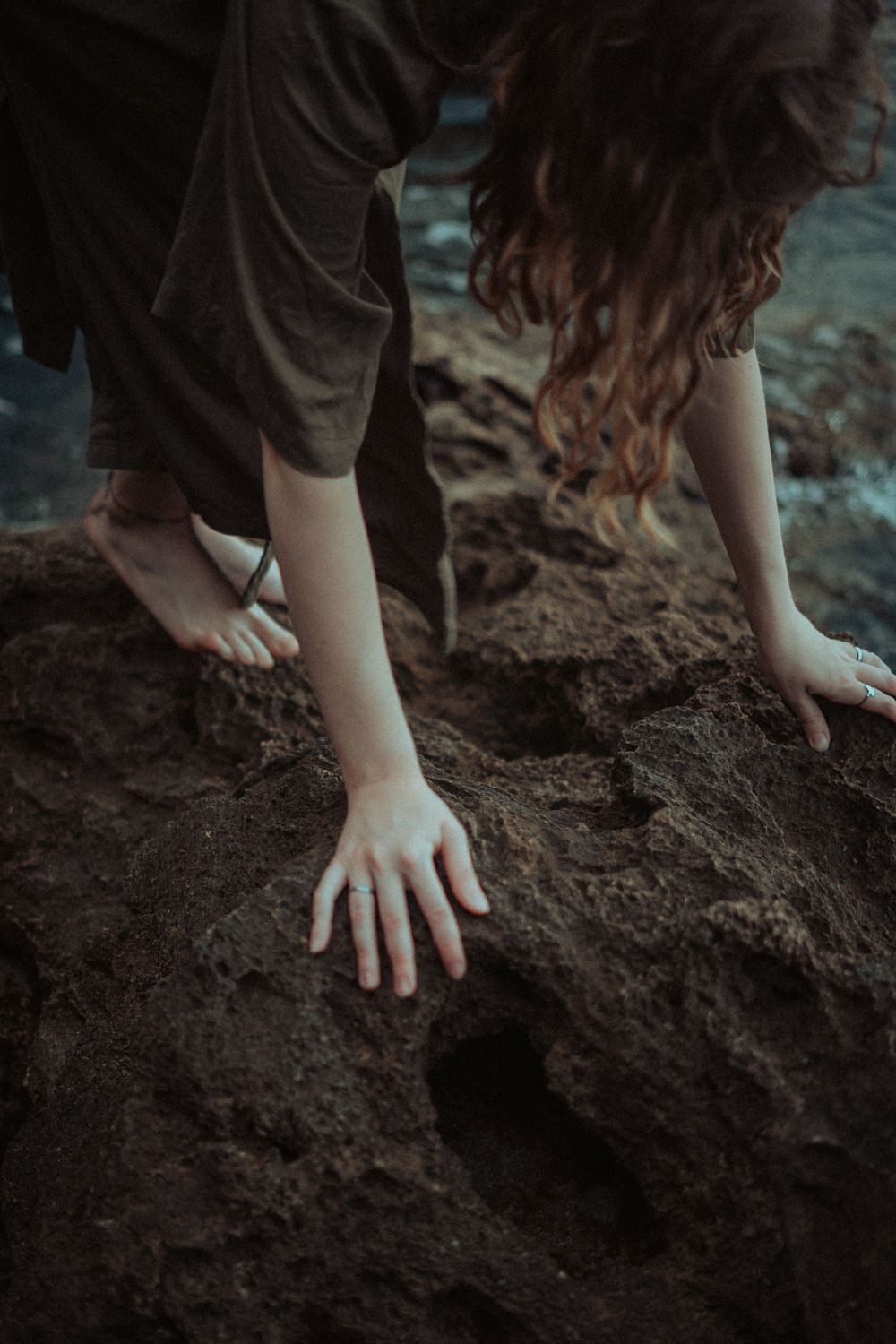 Woman Touching Rough Rock · Free Stock Photo