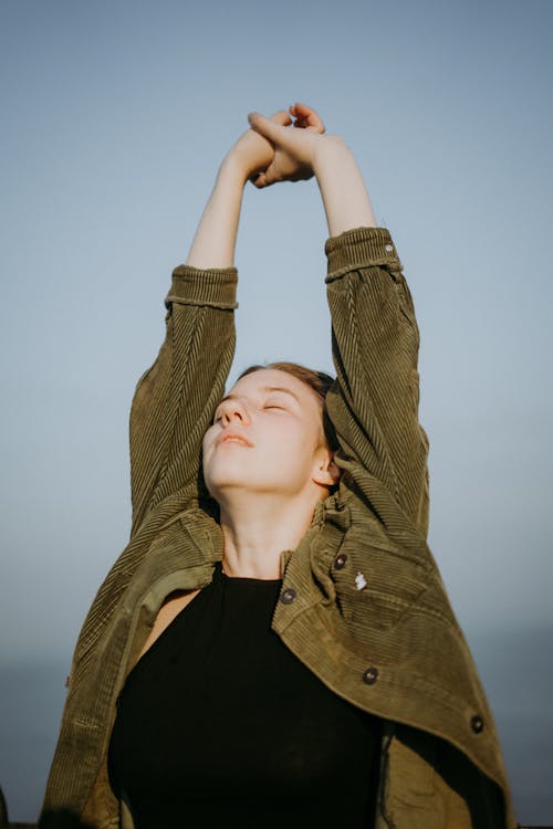 A Woman with her Arms Raised