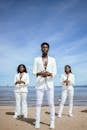 2 Men and Woman Standing on Beach