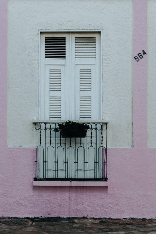 Balcony in a Pink Building · Free Stock Photo