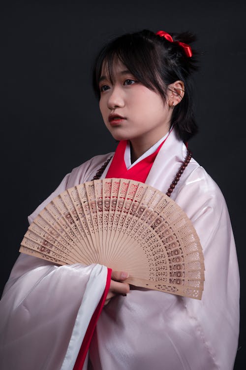 Young Woman in Kimono with Fan
